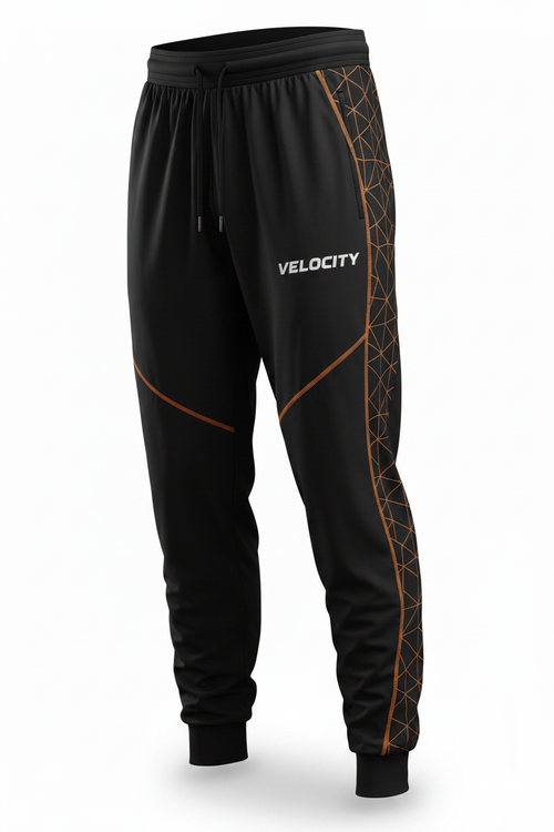 Velocity loose-fit athletic pants in black with orange geometric pattern and VELOCITY text